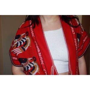 Red, tribal (?) design red cardigan